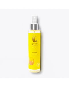 Bright yellow bottle of Key West Aloe Mango Body Mist with a spray nozzle, featuring a mango image and logo, set against a plain white background.