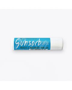 A tube of Key West Aloe Sunsorb SPF 30 lip balm with blue and white packaging, labeled as coconut flavor, on a white background.